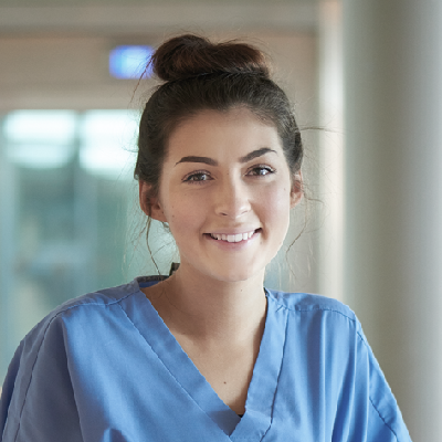 Student, young woman in blue scrub