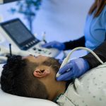 RVS Registered Vascular Sonographer photo of a person completing a diagnostic test during an education class to build her career in vascular technology