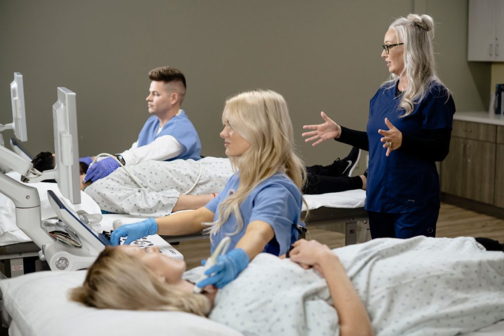 Classroom setting showing instructor teaching echocardiography vascular technology